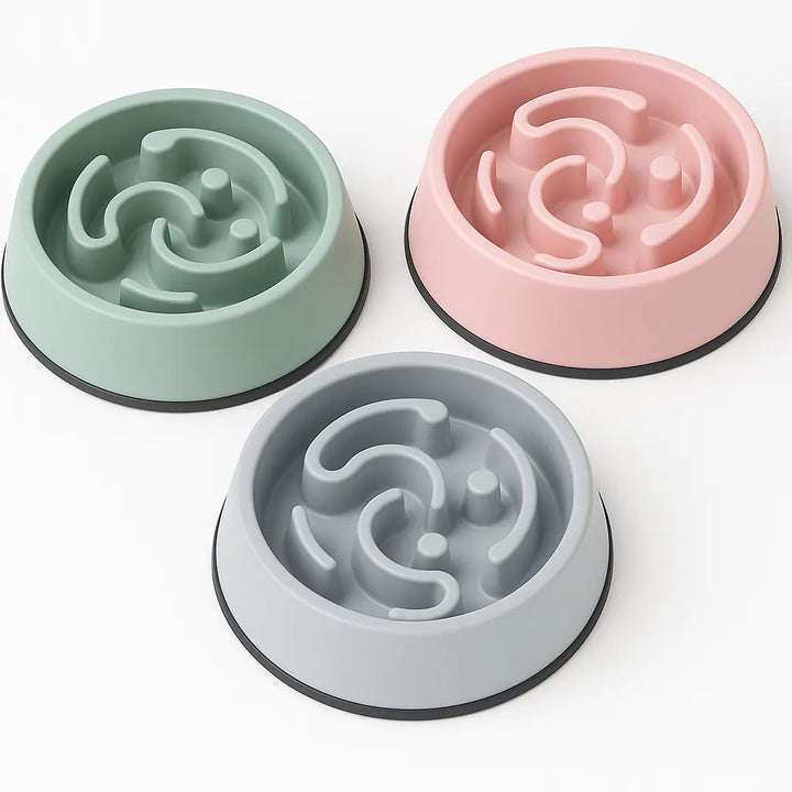 "Dog eating from slow-feeder bowl with raised ridges"
"Non-slip slow-feeder bowl preventing fast eating"
"Durable pet feeding bowl with maze design"